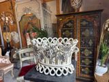 a white crown sitting on top of a table in a room