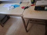 a table with a laptop and a printer on it