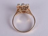 an image of a gold ring with three diamonds