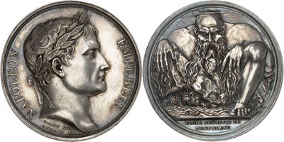 a close up of a silver coin with a man on it