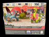 a box with a toy figure of a dragon and a pokemon figure