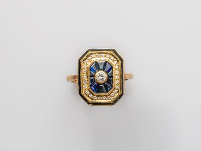 an 18k gold and sapphire ring with diamonds
