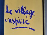 blue writing on a yellow box with a blue handle
