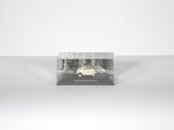 an image of a white car in a clear box on a white surface