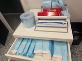 a table with a bunch of medical supplies on it