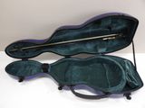 a violin case that is open on a white surface