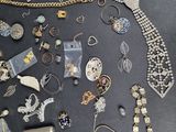 many different types of jewelry on the table