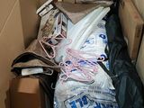 a cardboard box filled with assorted items in it