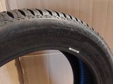 a close up of a tire on a cardboard box with a cardboard box in the background