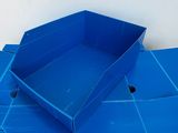 several blue boxes stacked on top of each other in a pile