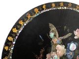a black umbrella with a painting of flowers on it