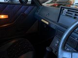 a car that is sitting in a garage with a steering wheel