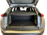 the back of a car with its trunk open and the back seats folded down