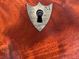 a close up of a wooden box with a lock on it