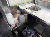 an image of a kitchen area with a sink and a counter