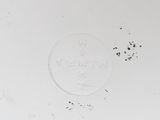 a white plate with a clock on it on a table
