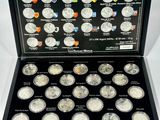 a display case with a lot of silver coins in it