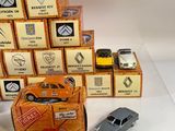 several toy cars are stacked on top of each other on a table