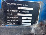 a sign on the side of a blue truck