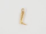 a gold plated charm with the letter l on it