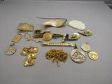 several different types of gold and silver jewelry on a table