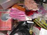 a pile of items that include a hair dryer, a hair dryer, and a lot of other items