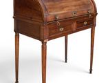 an old wooden desk with drawers and a drawer underneath it