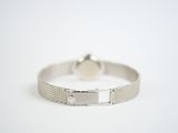 silver bracelet with a diamond clasp on a white background