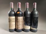 three bottles of wine are lined up on a table