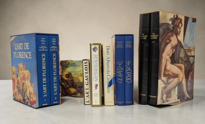 a lot of books that are sitting on a table