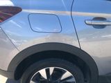 a close up of a car ' s tire on the side of the road