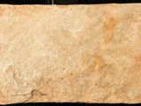 a piece of stone that has been placed on a black surface