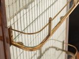 a bird cage with a bird inside of it