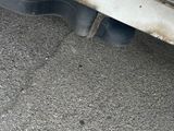 a close up view of a car ' s exhaust pipe and exhaust pipe