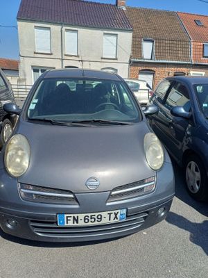 a small car that is parked in a parking lot