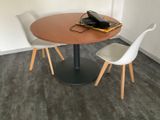 a table with two chairs and a phone on top of it
