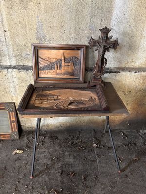 a small table with a picture on it next to a picture frame