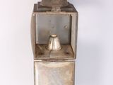 a small metal box with a bell on top of it