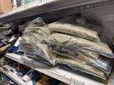many bags of marijuana sitting on a shelf in a store