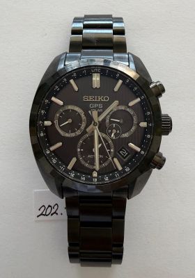 a picture of a watch on display on a white surface