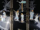 four panels of black and gold decorated with asian women and birds
