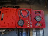 a red case with tools in it sitting on the floor