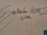 a close up of a piece of paper with a signature on it