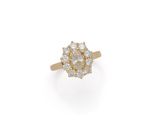 an 18k yellow gold diamond cluster ring