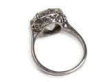 an image of a close up of a diamond ring on a white surface