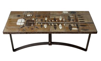 a table with a mosaic tile top and metal legs