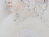 portrait of a young man with curly hair and a white shirt