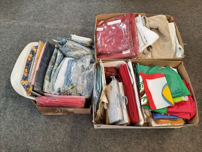 a box full of clothes sitting on the floor