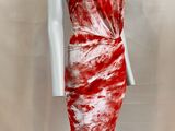 a red and white tie dye dress on a mannequin mannequin