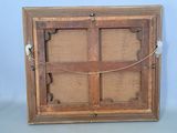 an old wooden picture frame with a rope hanging from it ' s sides